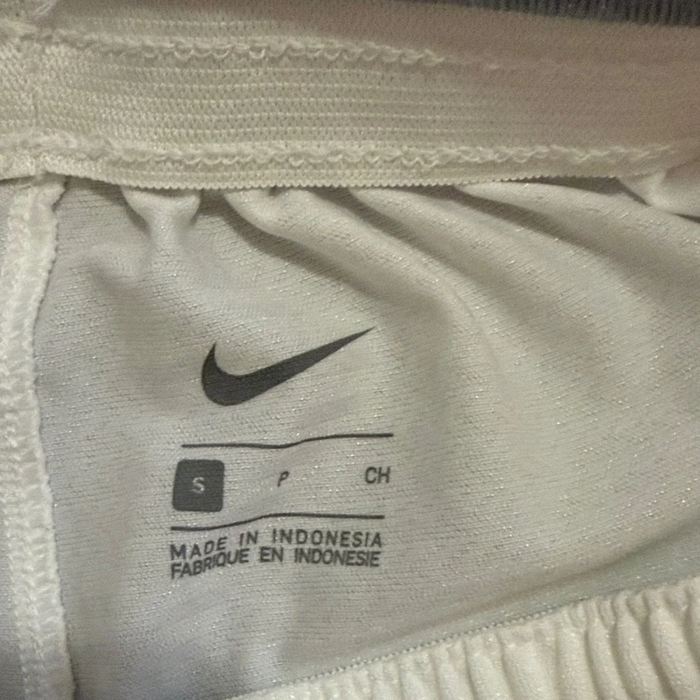 Nike Men's White Athletic Shorts with Black Swoosh